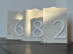 the numbers are placed next to each other on marble block blocks that spell out the number six and two