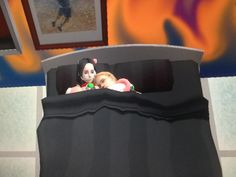 two dolls are sitting in the back of a baby car seat with fire painted on the wall behind them