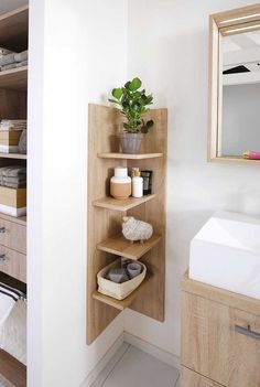 the bathroom is clean and ready to be used as a storage area for towels or other items