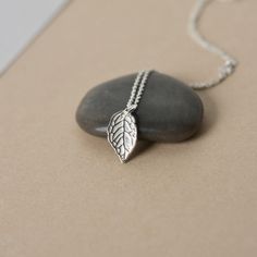 This minimalist charm necklace is perfect for everyday wear! It features a beautifully detailed sterling silver leaf that has a lovely bright shine and polish to it. The leaf is about 14mm long and 9mm wide and it hangs from dainty sterling silver cable chain. The simple design and nature inspired theme make this necklace a versatile accessory and it looks great alone or paired with others for a chic layered look. The necklace is fastened with a sterling spring ring clasp and you can choose your Sterling Silver Everyday Necklace With Nature-inspired Style, Everyday Sterling Silver Nature-inspired Necklace, Everyday Nature-inspired Sterling Silver Necklace, Everyday Silver Necklace With Nature-inspired Style, Silver Nature-inspired Necklace For Everyday, Everyday Silver Nature-inspired Necklace, Everyday Nature-inspired Silver Necklace, Sterling Silver Leaf-shaped Jewelry Gift, Minimalist Sterling Silver Leaf Jewelry