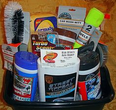 a black bucket filled with cleaning products on top of a table