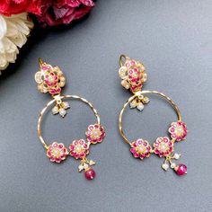 Featuring a pair of light-weight jadau chandbali earrings in 22k gold embellished with rubies and pearls. The earrings have a fishhook closure. The earrings weigh 11.1 GMs including 0.55 GMs in the hanging ruby beads and 0.26 GMs in hanging pearls.