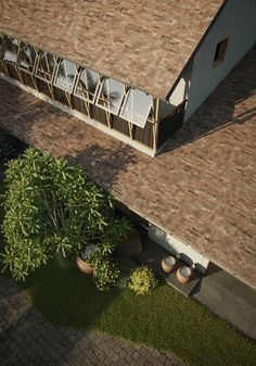 an aerial view of a house with plants in the yard