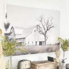 an old desk has a clock, vases and other items on it in front of a barn - like painting