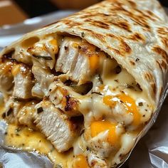 a chicken and cheese burrito cut in half