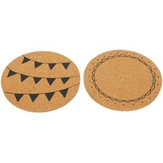 two cork coasters with black and white designs on them