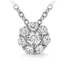 a diamond necklace with a flower design on the front and center piece in white gold