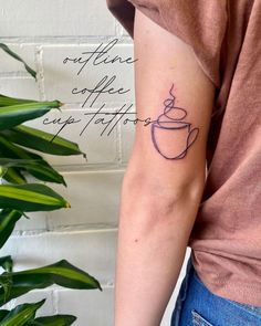 a woman's arm with a tattoo on it that reads coffee and a cup