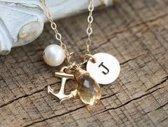 "Description 1. a 14k gold filled small anchor charm 2. a 14k gold filled initial disc (3/8\", 22ga) stamped with an initial in your choice of font 3. a custom birthstone 4. a freshwater pearl 5. a 14k gold filled chain closed with a lobster clasp ALL COMPONENTS ARE 14k GOLD FILLED Stamping is done skillfully by hand with quality stamp punch sets. Each stamping will be uniformly deep, well centered and well aligned - \"hand-crafted\" is not an excuse for substandard work! The stamping can be bla Beachy Stuff, Hope Anchor, Anchors Aweigh, Ideal Closet, Navy Anchor, Anchor Charm, Anchor Necklace, Coin Pearls, Etsy Bridesmaid Gifts