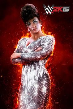 a woman with her arms crossed standing in front of a red background, wearing silver sequins