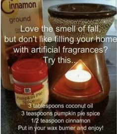 an advertisement for pumpkin pie with candles and cinnamon spice on the counter next to it