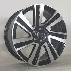 a black and silver wheel on a white background