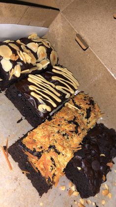 four different types of brownies with peanut butter drizzled on them