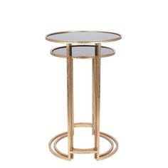 the side table is made from gold metal and has a round glass top with a circular base