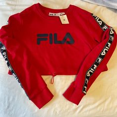 Nwt Fila Sweatshirt From Urban Outfitters. Can Be Cinched At The Waist And Made Smaller Red Long Sleeve Tops With Ribbed Cuffs, Sporty Red Top With Ribbed Cuffs, Green Rain Jacket, Fila Sweatshirt, Fila Jacket, Black Rain Jacket, Fila Logo, Fila Vintage, Velour Hoodie