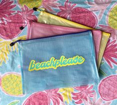 three small pouches with the word beach please printed on them sitting on a bed