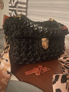 This beautiful black handbag, handmade crochet bag is so beautiful and sturdy. Made from 4 mm macrame cord with a black leather handle and a heavy duty crossbody strap with leopard print. So stylish and very roomy! I just love this style. My new designer tag is gorgeous. A little larger but a stylish look! 🖤 Handmade Crochet Bags, Black Handbag, Macrame Cord, Black Beauty, Black Handbags, Crossbody Strap, Leather Handle, Handmade Crochet, Crochet Bag