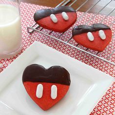 some heart shaped cookies are on a plate