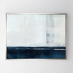 an abstract painting hangs on the wall