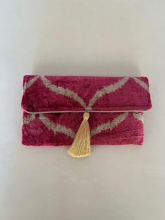 This uzbek  ikat velvet clutch bag with tassel  will make a great birthday gift for the ladies in your family. It combines the modern and traditional, the practical and artistic. Use it as an accessory that will turn heads and make every outfit stand out.  The bag is decorated with a fashionable tassel.Put your keys, phone and some special secret things in it and you'll complete that chic look you need for that big occasion or long-awaited party.  The traditional ikat fabric is handwoven with a Rectangular Tasseled Clutch As Gift, Velvet Clutch Bag, Uzbek Ikat, Bag With Tassel, Velvet Clutch, Silk Ikat, Ikat Fabric, Great Birthday Gifts, Silk Velvet