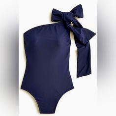 Nwot Navy Blue One Piece Swimsuit With Adjustable Bow On Left Shoulder. Brand New, Never Worn. “We Re-Imagined Every Single Suit In Our Swim Collection Using Over 60 Percent Recycled Materials To Help Keep Waste Out Of Oceans And Landfills. This Sweet New Take On Our One-Shoulder Style Is Crafted From A Special Fabric That Incorporates Recycled Nylon. Full Coverage. Low-Cut Leg. High-Rise Back. 82% Recycled Nylon/18% Elastane. 92% Recycled Poly/8% Elastane Lining. Built-In Upf 50 Sun Protection Chic Navy Swimwear For Vacation, Chic Navy Swimwear For Summer, Navy Bodysuit For Poolside, Navy Beachwear Bodysuit For Summer, Blue One-shoulder Swimwear For Spring, Chic Fitted Navy Swimwear, Navy One-piece Swimwear For Vacation, Blue One-shoulder Summer Swimwear, Fitted Blue Tie-back Swimwear