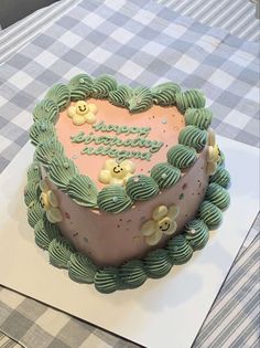 a heart shaped cake on top of a table