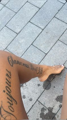 a woman's legs with writing on them