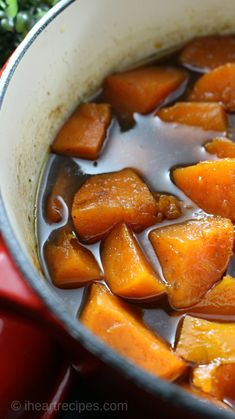 a pot filled with stew sitting on top of a stove