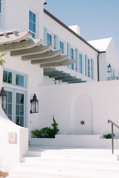 a white house with steps leading up to it