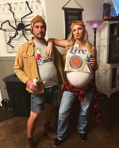 a man and woman are dressed up as pregnant bellys for the halloween costume contest