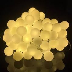 a bunch of white balls sitting on top of a table