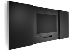 a black wall mounted tv next to a white wall