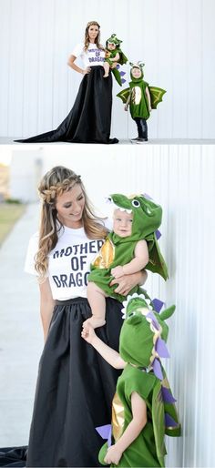 a woman in a black dress holding a small child wearing a t - shirt that says mother of dragon