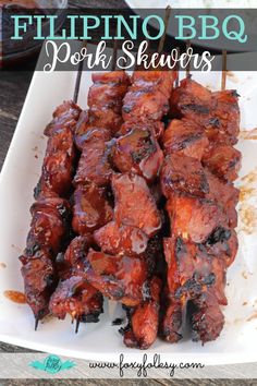 the ribs are covered in bbq sauce and served on skewers