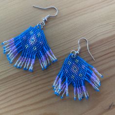 Handmade In Bali. Beautiful Handcrafted Matsumoto Bead Earrings With Unique Bohemian Designs:) Happy Shopping! Blue Beaded Festival Earrings With Ear Wire, Blue Beaded Earrings For Festival With Ear Wire, Handmade Blue Beaded Earrings, Purple Handwoven Earrings As A Gift, Blue Tiny Beads Earrings For Festivals, Handmade Lavender Beaded Earrings For Gift, Handwoven Blue Jewelry With Round Beads, Blue Handwoven Round Bead Jewelry, Blue Handwoven Round Beads Jewelry