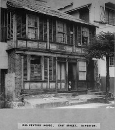 an old black and white photo of a house in the 1800's or early 1900's