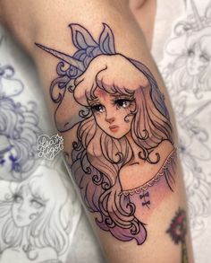 a girl with long hair and a unicorn hat on her head is shown in this tattoo design