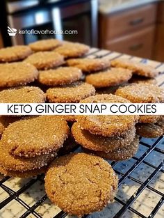 some cookies are on a cooling rack and the words keto ginger snap cookies above it