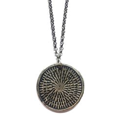 This unique and textural carved medallion is reversible to another carved pattern. It is reminiscent of a mandala. The meaning of mandala is Sanskrit for "circle." A mandala has a concentric structure, offering balancing visual elements. The purpose of a mandala is to serve as a tool to help harmonize and bring about unity, to absorb the mind so that the chatter stills and higher consciousness can be reached. Made of sterling silver on an oxidized, adjustable 16-18" sterling chain. Engraved Medallion Necklace, Carved Medallion Amulet Necklace, Artisan Medallion Necklaces With Oxidized Finish, Artisan Style Medallion Necklaces With Oxidized Finish, Artisan Medallion Necklace With Oxidized Finish, Artisan Carved Medallion Necklace, Bronze Etched Medallion Jewelry, Amulet Style Medallion Necklace With Large Pendant, Spiritual Medallion Necklace With Etched Details