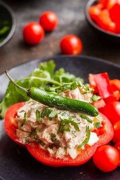 a close up of a plate of food with tomatoes