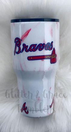 the atlanta braves ceramic travel mug is on display