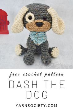 a crocheted dog sitting next to a red mailbox with the text free crochet pattern dash the dog