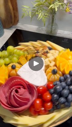 a platter filled with different types of fruits and vegetables