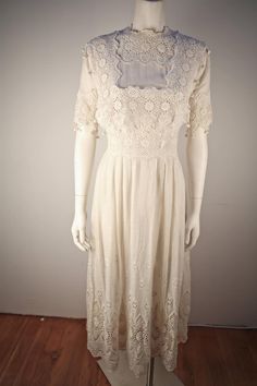 Cream Cotton Dress With Intricate Embroidery, Cotton Broderie Anglaise Wedding Dress, Wedding Cotton Dresses With Broderie Anglaise, Broderie Anglaise Cotton Wedding Dress, White Elegant Victorian Dress With Broderie Anglaise, White Victorian Wedding Dress With Broderie Anglaise, White Broderie Anglaise Victorian Wedding Dress, Elegant Wedding Dresses With Broderie Anglaise, Vintage Wedding Dresses With Intricate Embroidery