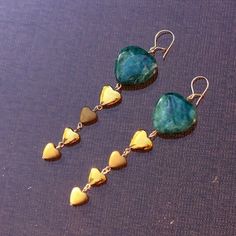 "Green Jasper & gold Hematite Hearts 14 karat gold filled long drop Earrings 3 1/4\" total length I pay close attention to detail because I want you to love your jewelry forever that I made for you. It's very important to me that this piece is in your collection for years to come. We do our best to choose each stone carefully and purposeful for every piece. However there might be slight differences in color size shape and clarity which makes each item unique and one of a kind. Each piece of jewelry will come in a colored satin drawstring bag for it's protection and storage or to be ready to give as a gift. WE WANT TO THANK YOU FOR TAKING THE TIME TO VISIT OUR SHOP!   If you'd like to stay up to date with our latest creation or collection, please add our store to your favorites." Unique Gold Earrings For Valentine's Day, Gold Dangle Heart Earrings In 14k Gold Filled, Gold 14k Gold-filled Dangle Heart Earrings, Unique Gold Heart Earrings, Unique Gold Heart-shaped Earrings, Gold Drop Jewelry For Valentine's Day, Black Labradorite, Diy Jewelry Unique, Green Jasper