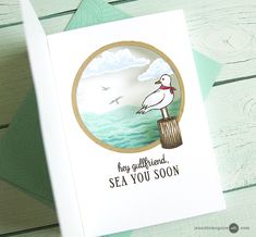 a card with a seagull sitting on a post