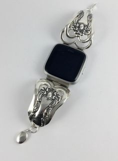 Fitbit Versa or Versa Lite Band made from antique silverplated forks . This band gives your Fitbit Versa a better option than the traditional rubber watch band . The band is made size specific and is sized to fit a 6 3/4 inch wrist size . Message if you need a different size and we can make a custom size if the pattern is in are stock . The band is 1 3/8 inch at the widest and 5/16 inches at clasp. The clasps is sterling silver oval clasp. Please message if we can answer any questions you may ha Formal Adjustable Silver Watch Band, Adjustable Silver Watch Band For Formal Occasions, Classic Adjustable Silver Watch Band, Vintage Silver Adjustable Watch Bands, Vintage Adjustable Silver Watch Bands, Fitbit Versa 2 Bracelet, Cheap Crystals, Versa 2 Fitbit Bands, Fitbit Versa 3