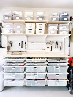 a garage storage area with lots of bins