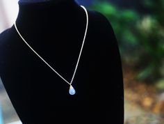 "This gorgeous necklace will be carefully handmade with absolutely lovely and truly unique handpicked AAA Rainbow Moonstone drops that glow and flash in amazing blue tones and beautiful rainbow colors. It will be lovingly wire wrapped in fine silver or 24K Gold filled wire, then hung on a petite cable chain. All metal elements are high quality & hypoallergenic for sensitive skin. The silver version can be oxidized for a more rustic-antique look. the  pendant will be about 13-15mm long. These stunning natural gemstones are each a one unique and one of a kind! They have a smooth finish and have been carefully hand cut and polished. This means that each stone varies slightly in size, shape and color but they are all stunning and have been lovingly handpicked for their quality and glow🌟The ch Blue Moonstone Teardrop Necklace, Teardrop Moonstone Necklaces For Jewelry Making, Handmade Teardrop Moonstone Crystal Necklace, Dainty Handmade Teardrop Crystal Necklace, Short Gold Necklace, Garnet Drop Earrings, Boho Crystal, Glass Drop Earrings, Blue Topaz Necklace