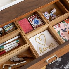 an open drawer filled with lots of crafting supplies